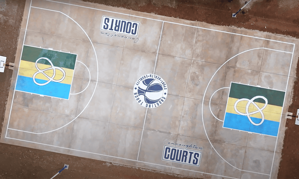 Aerial view of a basketball court with Shooting Touch logo and the Pat Connaughton Foundation.